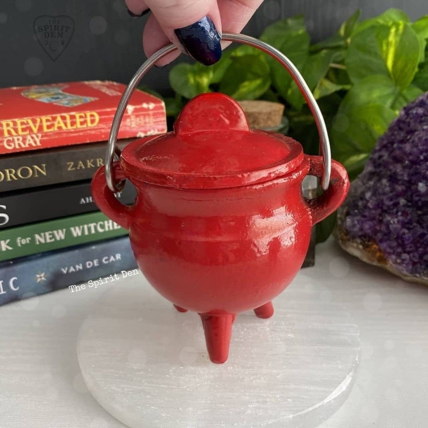 red enameled small cast iron cauldron